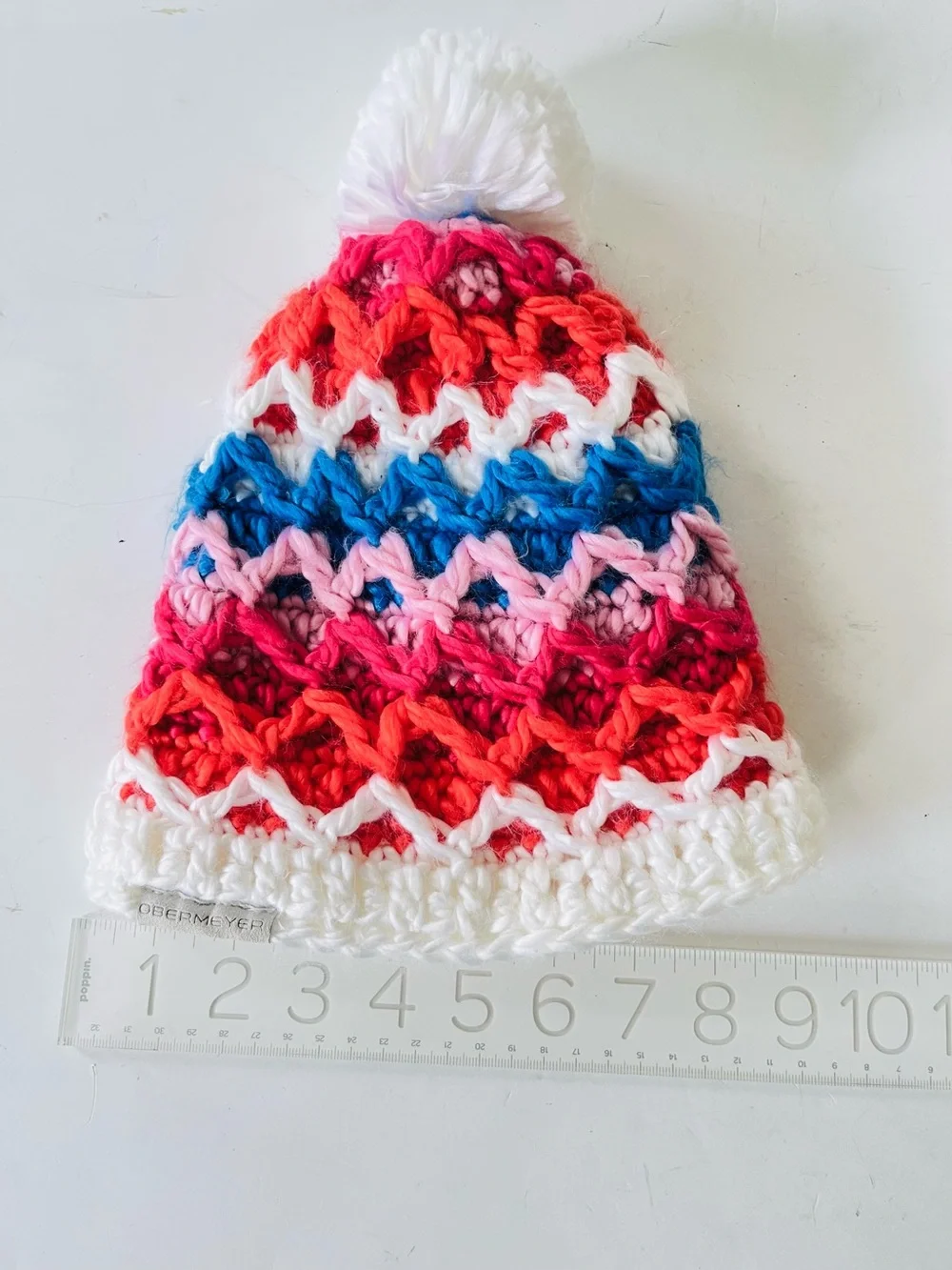 Obermeyer Teen  knit hat white blue red with pompom